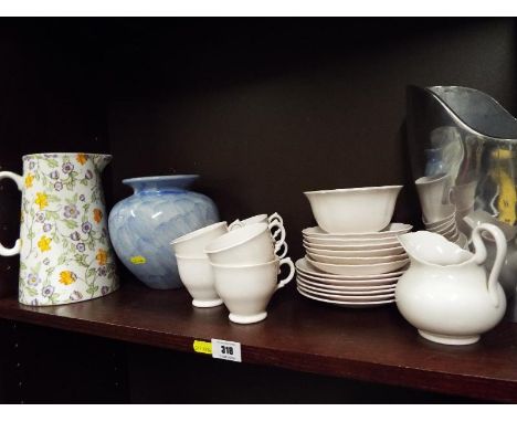 A mixed lot of ceramics to include a Tuscan, bone china tea service, six place setting, a water jug by Empire and two contemp