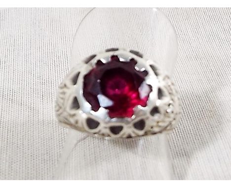 A gentleman's Eastern silver ring with large centre stone ruby, size O, unmarked but tested as silver Est £80 - £120