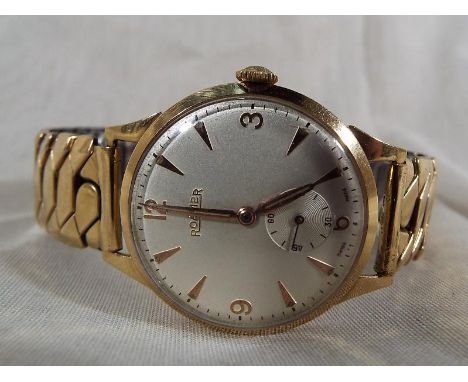 A gentleman's wristwatch, 9 ct gold case mounted on an Excalibur rolled gold expanding bracelet, silvered dial with applied g