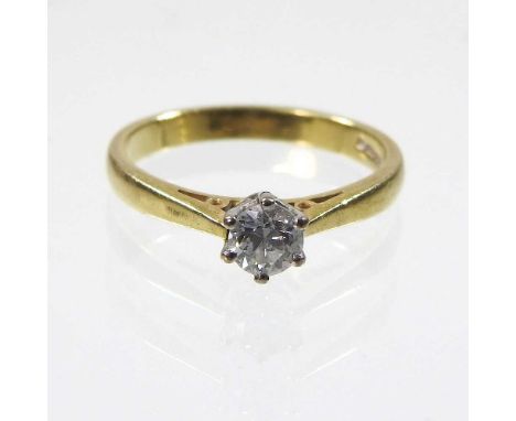 An 18 carat gold solitaire diamond ring, approximately 0.25 carats, 3.1g, size M