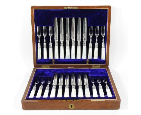 A set of twelve pairs of Victorian silver plated fish eaters, with mother of pearl handles, in a fitted case inscribed Benetf