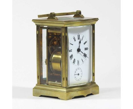 An early 20th century brass cased carriage clock, with a white enamel dial, 11cm high