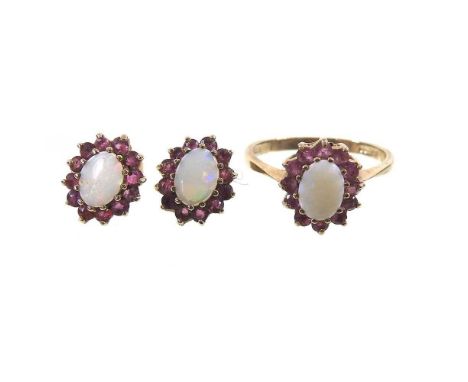 A 9 carat gold opal and ruby cluster ring, 2.1g, size N, together with a pair of matching earrings, 1.8g, boxed (3)