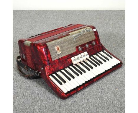 A Marinucci Recineti accordion, in a hard case