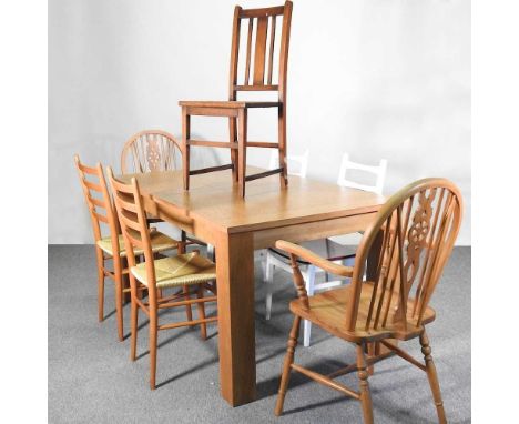 A modern light oak extending dining table, together with a collection of seven various dining chairs (8)151w x 91d x 76h cm c
