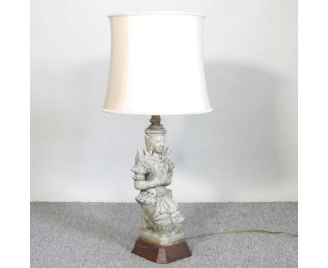 An Eastern pottery figural table lamp and shade, 80cm high overall