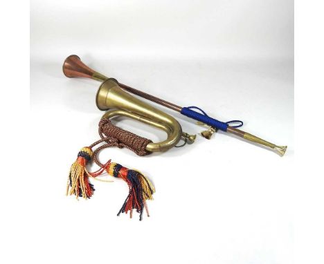 A brass hunting horn, 73cm long, together with another smaller (2)