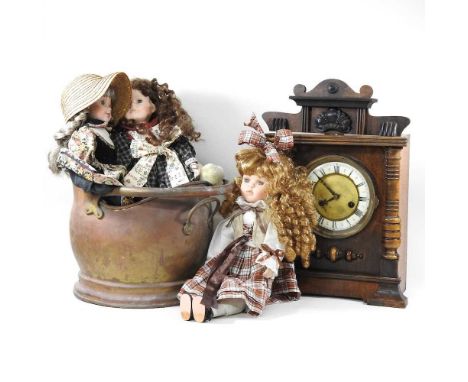 A Victorian mantel clock, together with a copper coal scuttle and various dolls