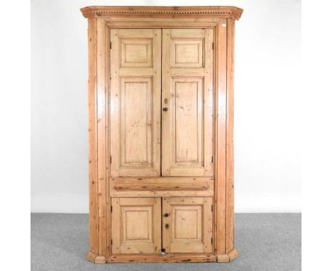 An antique pine barrel back standing corner cabinet, enclosed by panelled doors120w x 60d x 185h cmBottom shelf measures 25cm