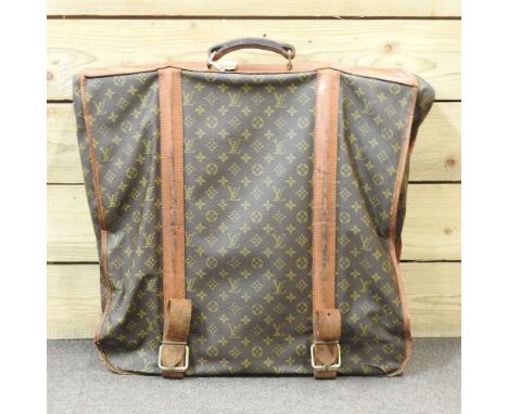 A Louis Vuitton vintage leather garment carrier, with LV monogram60w x 55h cm