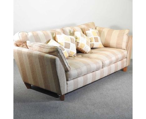 A modern gold striped upholstered sofa, with loose cushions225w x 100d x 88h cm