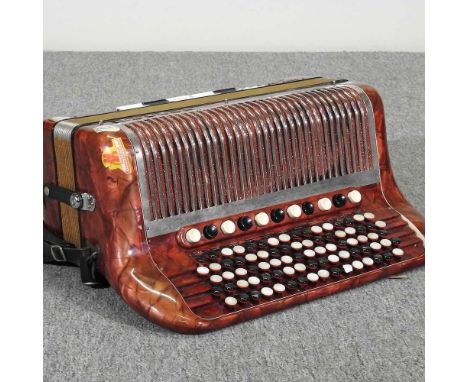 A Hohner Norm VII S accordion, in a hard case