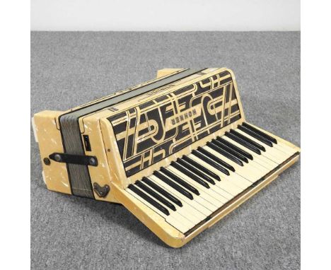 A Hohner Verdi IV accordion, in a hard case