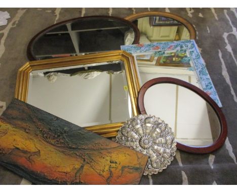 Six wall mirrors and one print of cave art