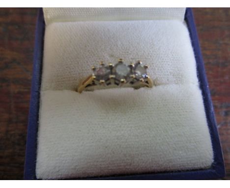 A 9ct gold and diamond three stone ring