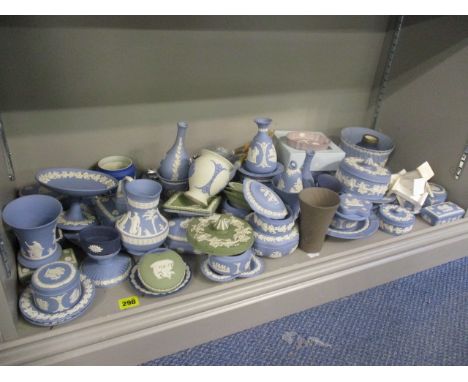 Wedgwood Jasperware dressing table ornaments in green, navy and light blue to include a table lighter, trinket boxes, plates 