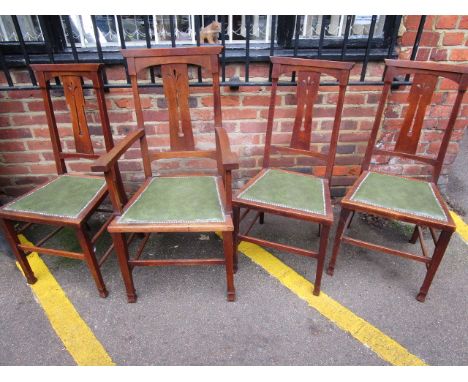 A set of four late 19th century oak Art Nouveau chairs, comprising three standards and one carver, with pierced central splat
