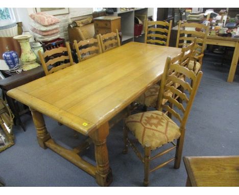 A Furniture Village pale oak refectory table having a planked top, raised on turned block legs, 30 h, 32w, 84 l and a matchin