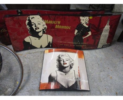 A large modern sculptured pop art picture of Marilyn Monroe, 58 x 20, along with a smaller matching one, 23 x 22