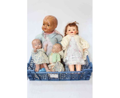 Four vintage dolls including walking and babies.