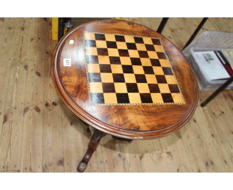 Victorian circular walnut chess top table on pedestal tripod base, 70cm by 52cm diameter.