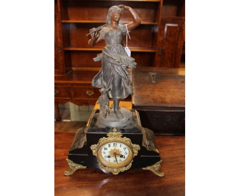 Ornate spelter and gilt metal mantel clock of a young girl and a lamb, with enamel dial, 53cm high.