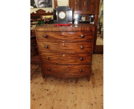 Victorian mahogany bow front chest of four long drawers on bracket feet, 111cm by 102cm by 55cm.