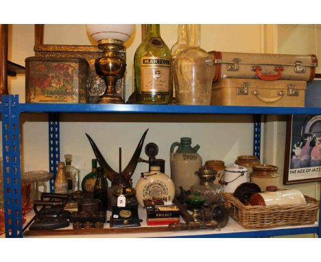 Stoneware jars and bottles, oil lamp, glass bottles, brass log bin, coffee grinder, set of weights, flat irons etc.