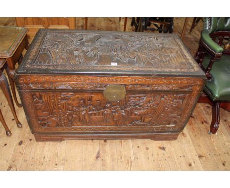 Oriental carved camphorwood trunk, 59cm by 104cm by 52cm.