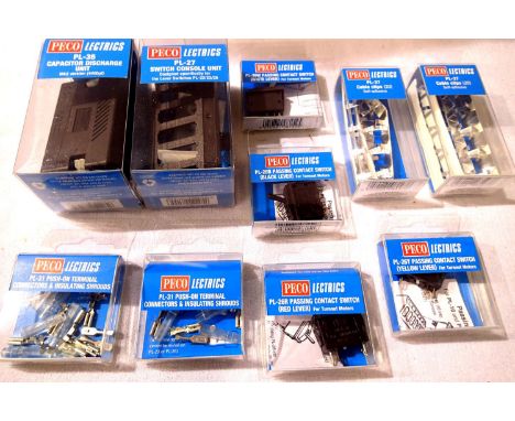 Ten Peco electric packs, includes C.D.U., switches, connectors, etc, all new in packets. P&amp;P Group 1 (£14+VAT for the fir