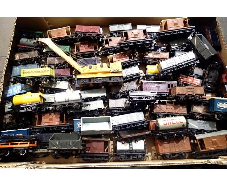 Approximately seventy unboxed unboxed OO scale wagons, various makes and types, all playworn, some damage/parts missing. P&am