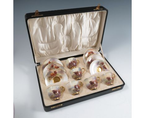 A cased Royal Worcester set of coffee cups and saucers, decorated with Highland cattle in landscape by Harry Stinton, dated c