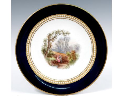 A 19th century Grainger's Worcester cabinet plate, decorated with a landscape of two figures by a cornfield, to a blue border