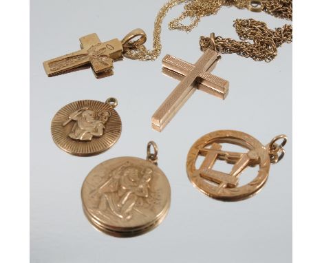 A 9 carat gold cross pendant, on a chain, together with another, a 9 carat gold St Christopher pendant, and another, and a 9 
