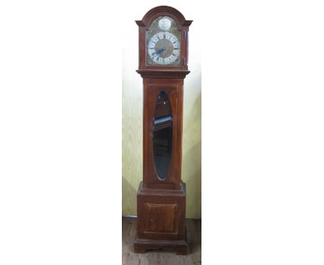 A 19th century mahogany cased long case clock, the arched brass dial engraved Tempus Fugit to the front and Made in Germany t