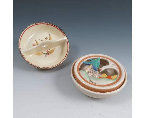 A Clarice Cliff Wilkinson Ltd pot pourri dish, of circular form, the pierced moulded cover decorated with a house and pine tr