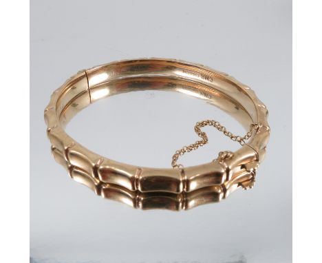 A&nbsp; 9 carat gold hinged bangle, fashioned to look like bamboo, 6mm wide, internal diameter 6.2cm, 9.9g gross