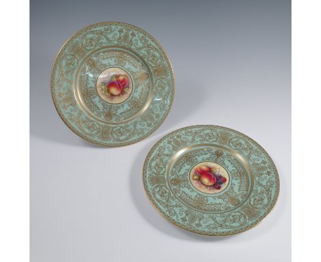 A pair of Royal Worcester cabinet plates, the centres decorated with fruit to a mossy background by C Hughes, to a deep&nbsp;