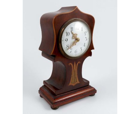 An Edwardian mahogany mantel clock, of shaped balloon form, with inlaid decoration, the white enamel dial with gilt hands, he