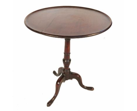 A 19th century mahogany tilt top tripod table, raised on a turned column terminating in three outsplayed feet, diameter 23.5i