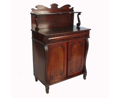 A Victorian mahogany chiffonier, fitted with a shelf to the back with scroll supports, over one long drawer over a pair of cu