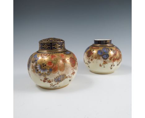 A pair of Royal Crown Derby pot pourri, one cover missing, of globular form with wrythen moulding, decorated in red, blue and