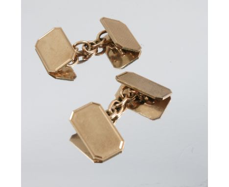 A pair of 9 carat gold cufflinks, the one plain and one engine turned rectangular panels with chain link connectors, 6.5g gro