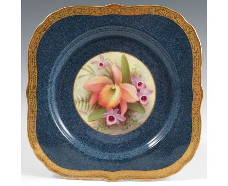 A Royal Worcester plate, decorated with a central panel of orchids by Albert Shuck, circa 1926, with a Sabrina blue and gilt 