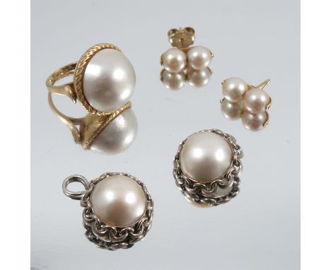 A Mabe pearl ring, stamped '18ct', finger size N, 19g gross, together with a pair of Mabe pearl earclips, stamped '18ct', 17g