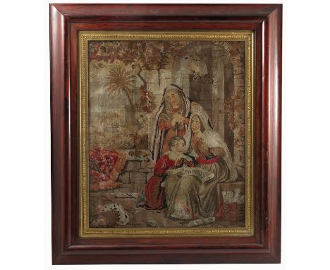 A 19th century tapestry picture, of a mother, father and child in a garden scene, 21ins x 17ins, in a rosewood frame