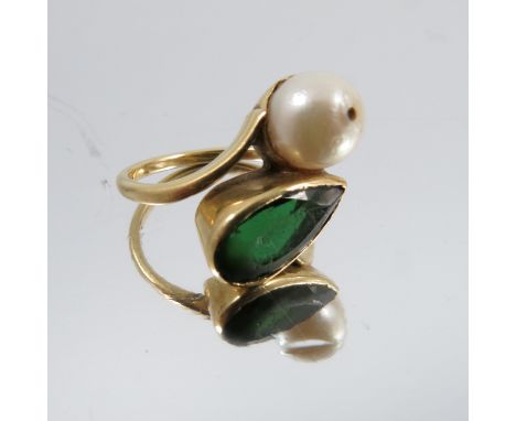 A green tourmaline and cultured pearl two stone ring, stamped '18ct', finger size I 1/2, 5.2g gross