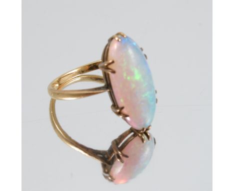 A single stone opal ring, stamped '18ct', finger size L 1/2, 2.6g gross, together with a single opal and diamond drop earring