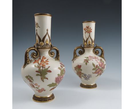 A pair of Royal Worcester gilded ivory vases, decorated with flowers and having a pair of gilt scroll handles, shape number 1