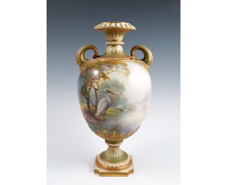 A Royal Worcester vase, decorated all around with storks in a river landscape by W Powell, having dolphin mask handles, marke